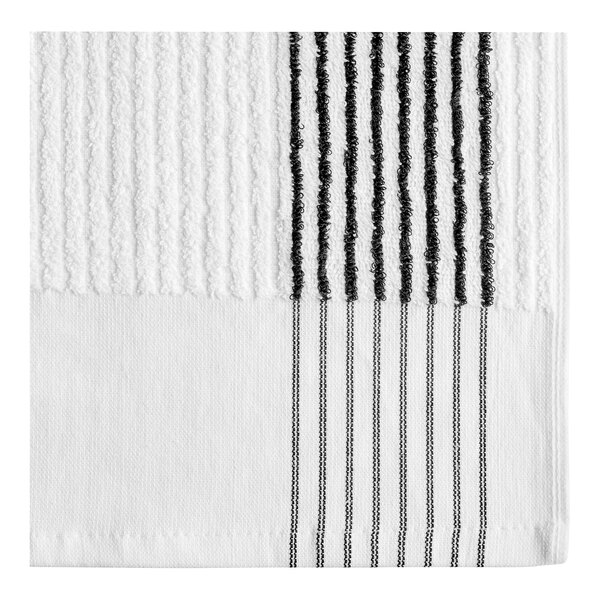 A close-up of a white towel with black stripes.