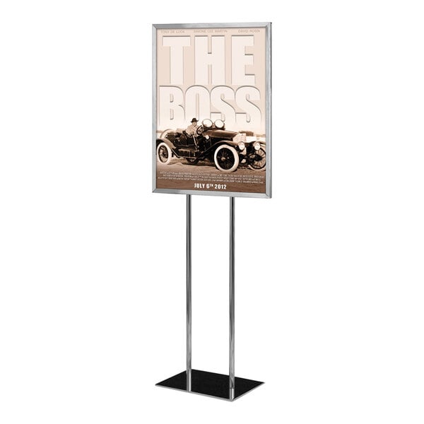 A United Visual Products pedestal poster stand with a car poster on it.