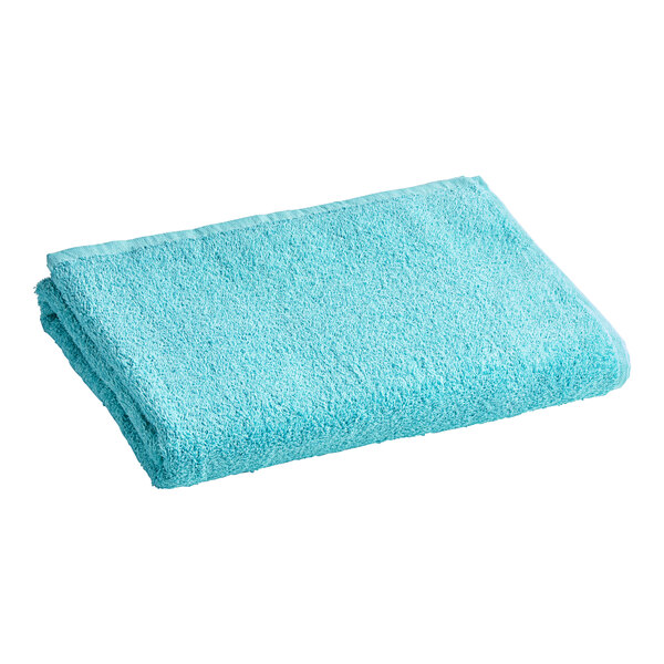 An aqua blue Oxford pool towel folded on a white background.