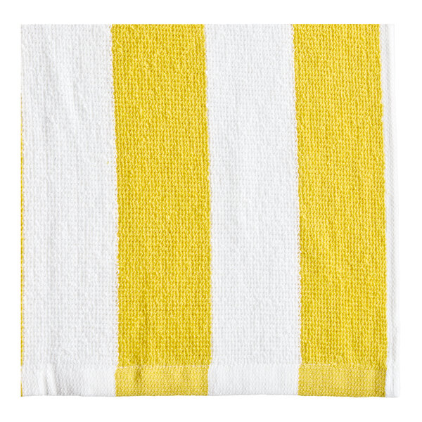A close up of an Oxford Playa yellow and white striped pool towel.