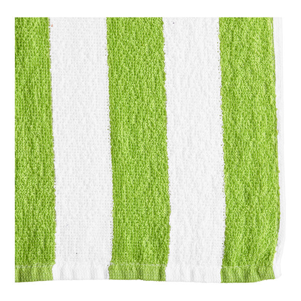 A close-up of a green and white striped Oxford pool towel with a white stripe.