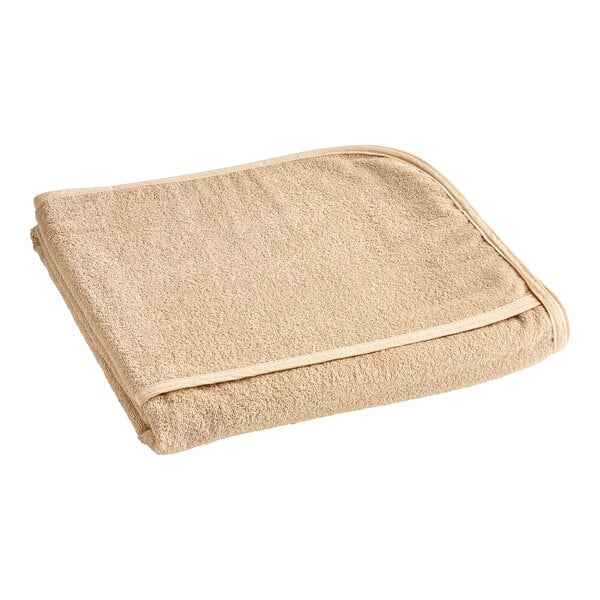 A folded beige Oxford lounge chair cover on a white background.
