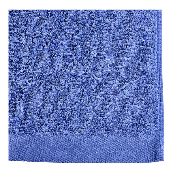 An Oxford Royal Blue pool towel with a white border.
