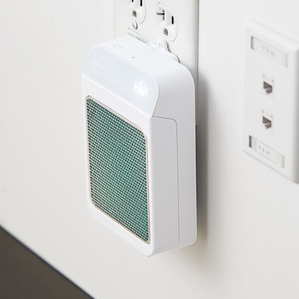 A white Ourfresh air freshener cabinet with a green speaker.