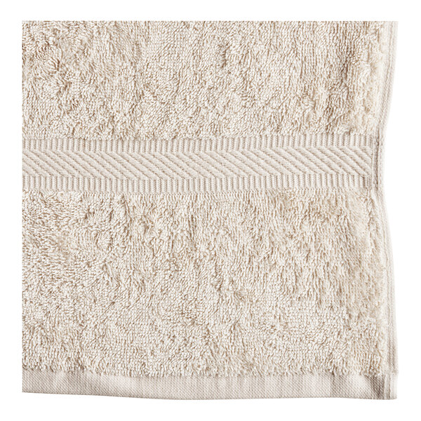 A white Oxford Imperiale pool towel with a striped border.