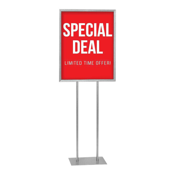 A white rectangular United Visual Products pedestal poster stand with a red sign reading "Special Deal" on it.