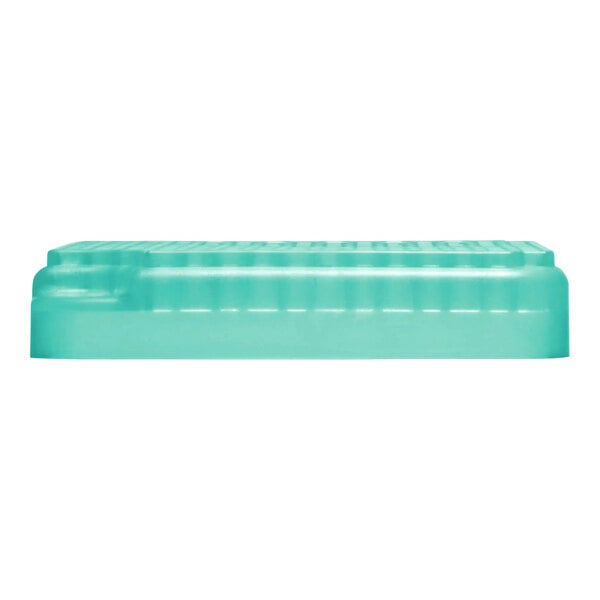 A rectangular, translucent teal air freshener refill.