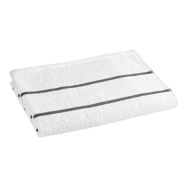 A white pool towel with black stripes.