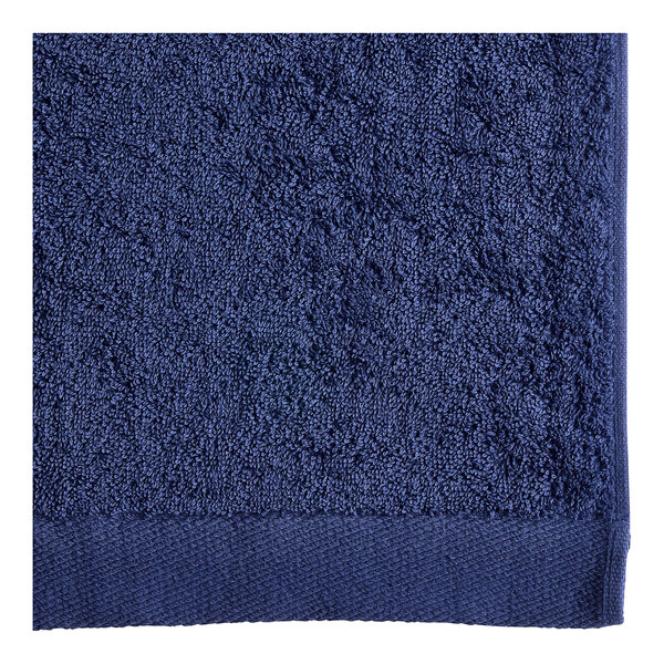 An Oxford navy blue pool towel with a white background.