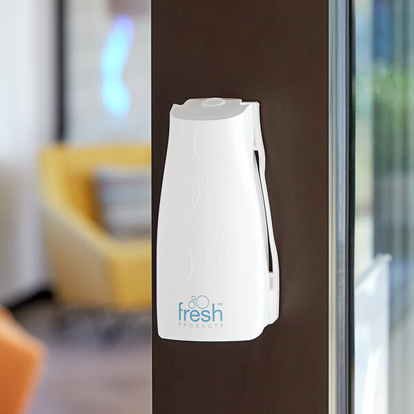 A white Fresh Products air freshener cabinet with a black handle.