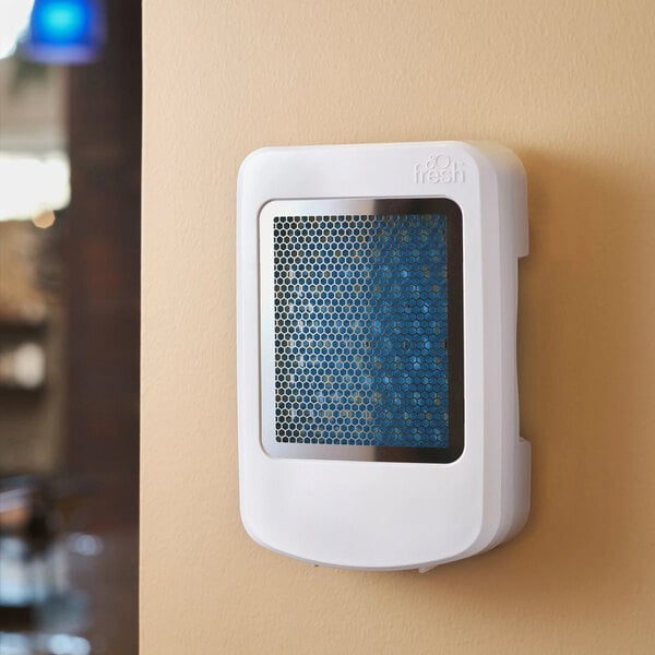 An air freshener device mounted on a wall.