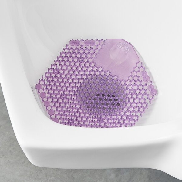 A purple hexagon shaped urinal screen.