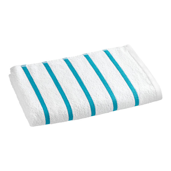 A white pool towel with blue stripes.