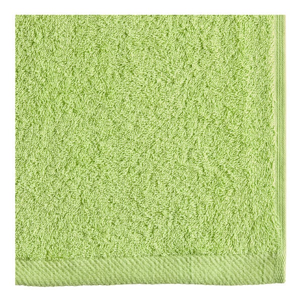 An apple green Oxford Premium pool towel.