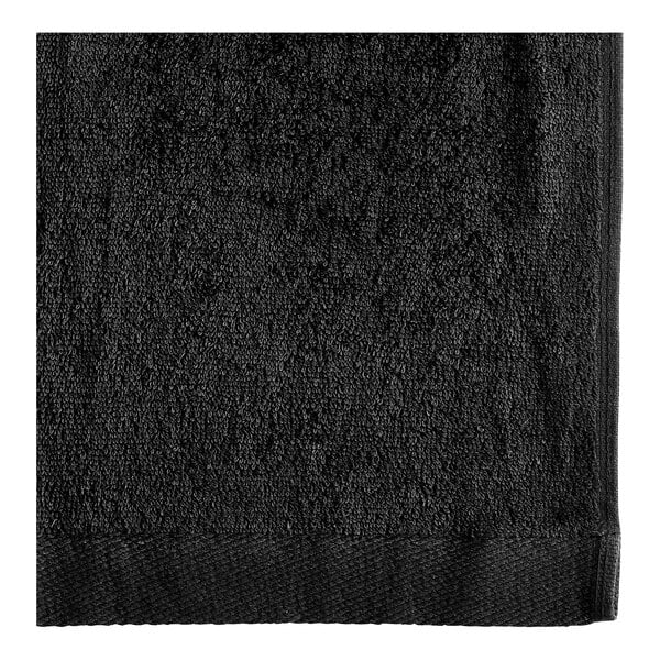 A black towel with a black border.