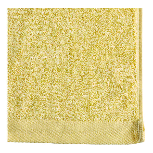 A yellow Oxford pool towel with white edges.