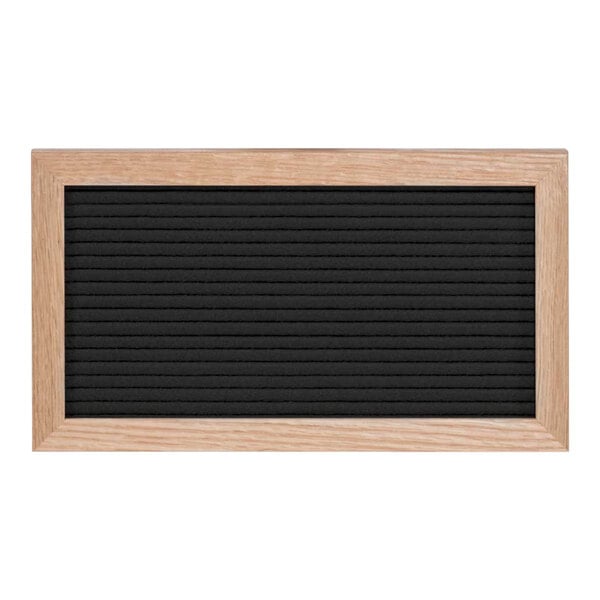 A black board with a light oak wood frame.