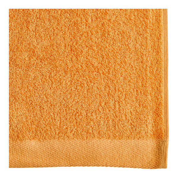 An orange Oxford pool towel.