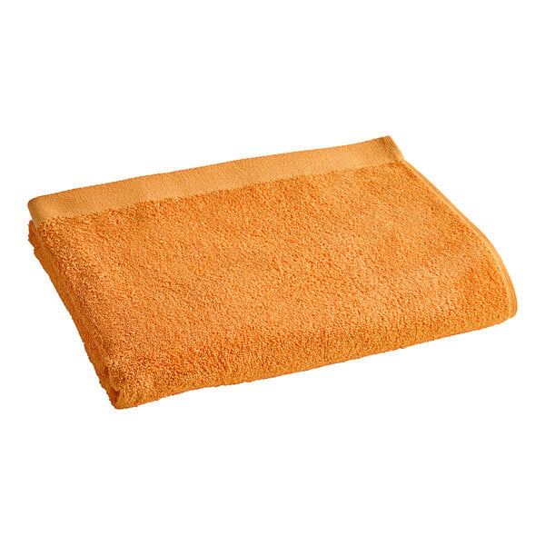 An orange Oxford pool towel.