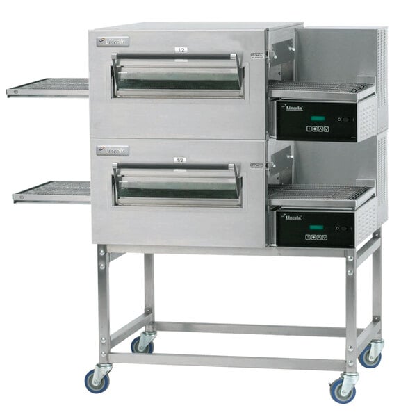 A double stacked Lincoln Impinger conveyor oven with a stainless steel exterior.