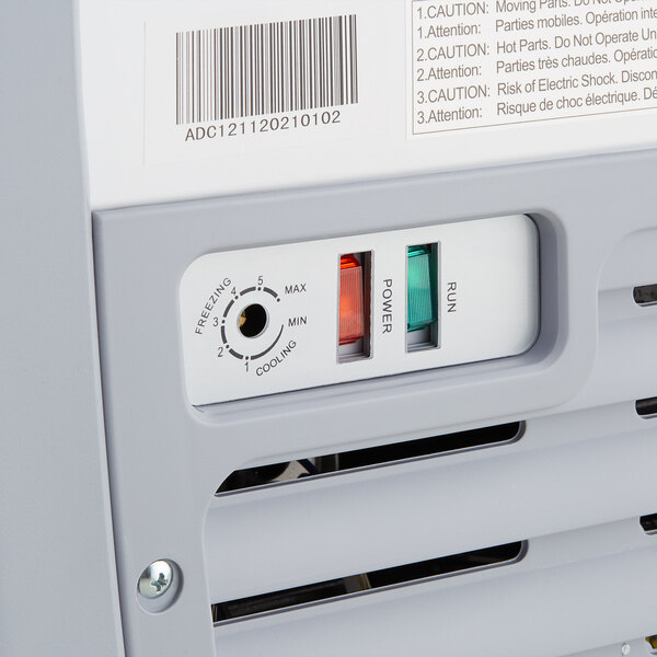 An Avantco ice cream dipping cabinet with a curved sneeze guard.