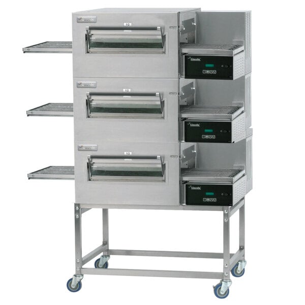 A Lincoln Impinger II triple stacked electric conveyor oven with three racks.