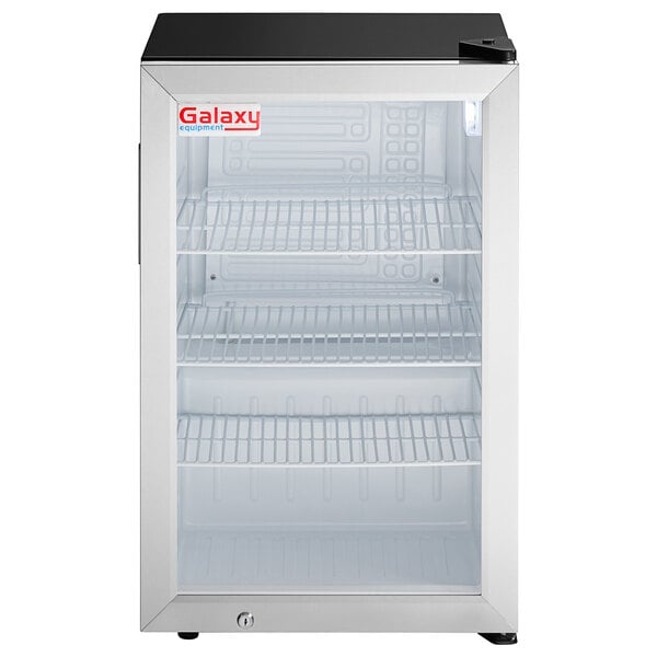 A Galaxy black countertop refrigerator with shelves and glass doors.