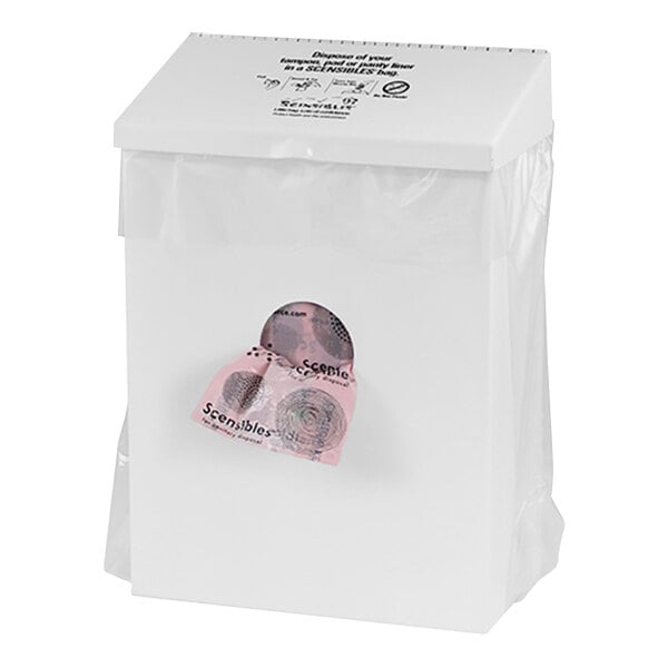 A white metal sanitary napkin receptacle with a pink paper bag in it.