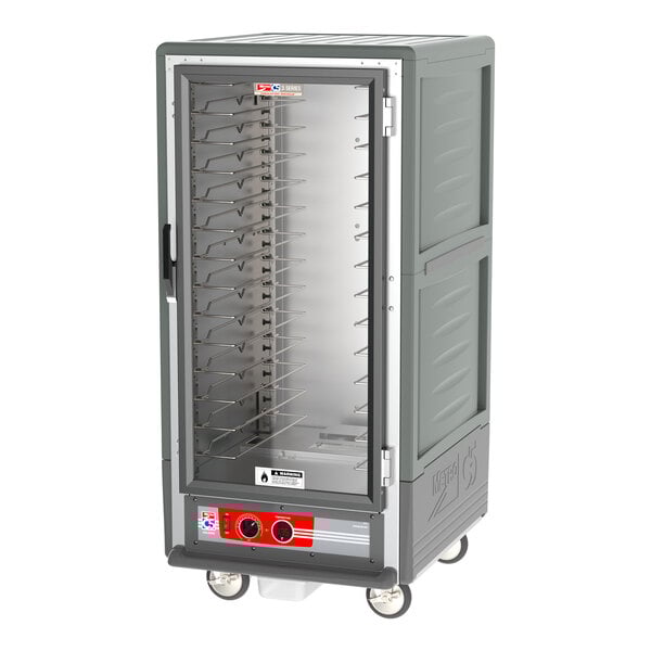 A large grey Metro C5 heated holding cabinet with clear glass doors and shelves.
