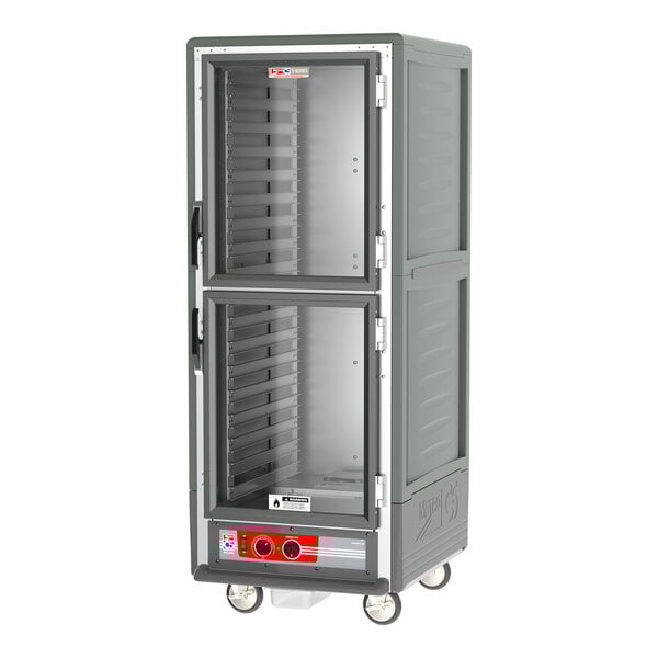 A Metro C5 gray heated holding cabinet with clear Dutch doors on wheels.