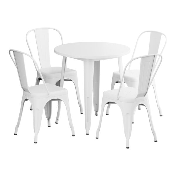 A white Lancaster Table & Seating outdoor table with four white chairs.