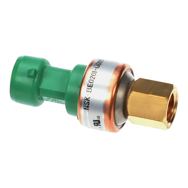 A Carrier low pressure transducer with a green and white cylindrical object and brass nut.