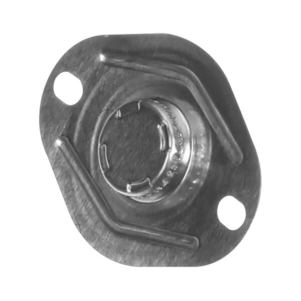 A close-up of a metal cap with a white circle inside.