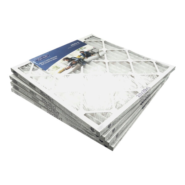 A stack of four Carrier air filters.