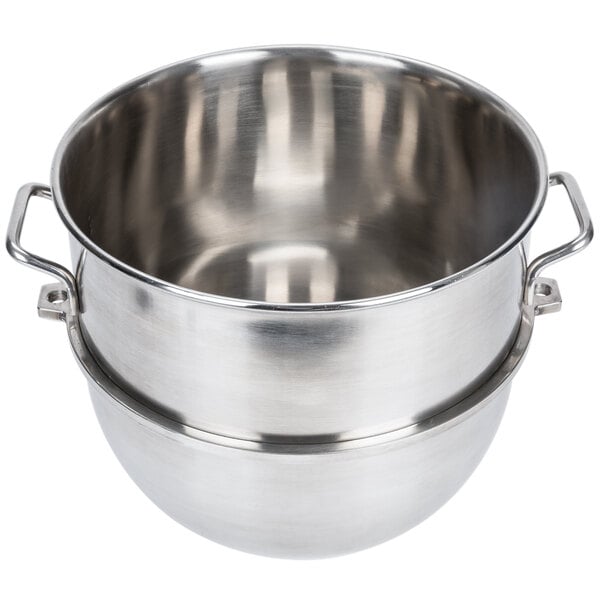 A silver stainless steel Vollrath bowl with two handles.