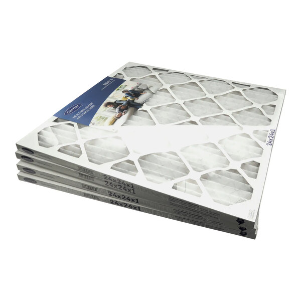 A stack of four Carrier air filters.