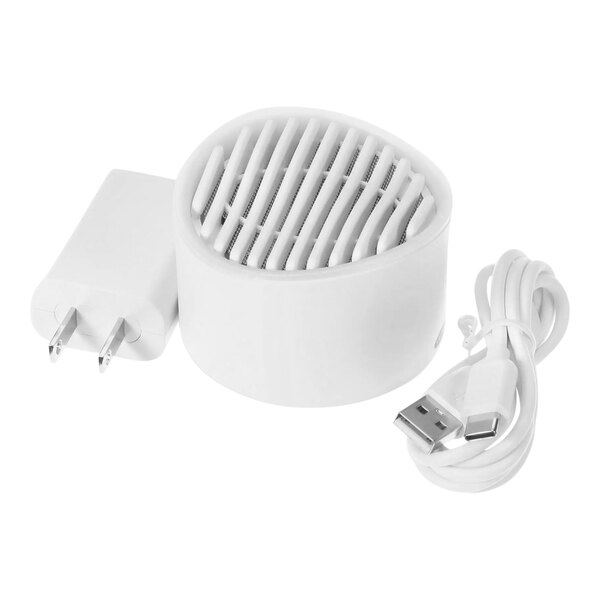 A white round Carrier air monitor with a plug.