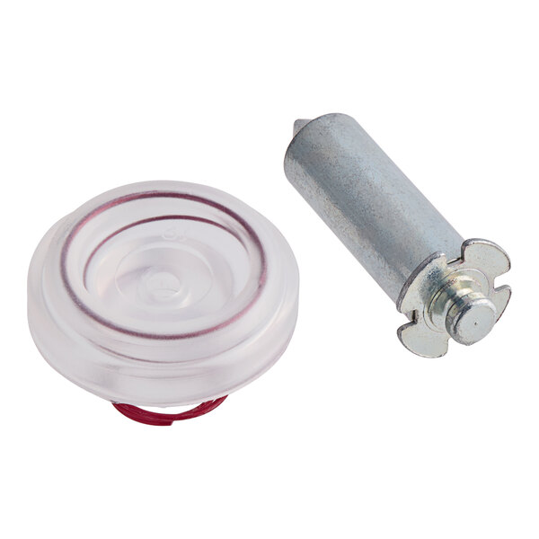 A close-up of a metal cylinder with a plastic and metal object inside.