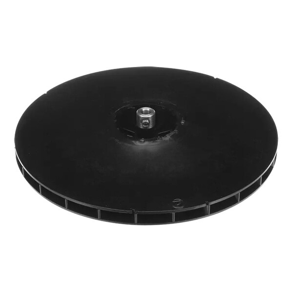 A black circular blower wheel with a hole in the center.