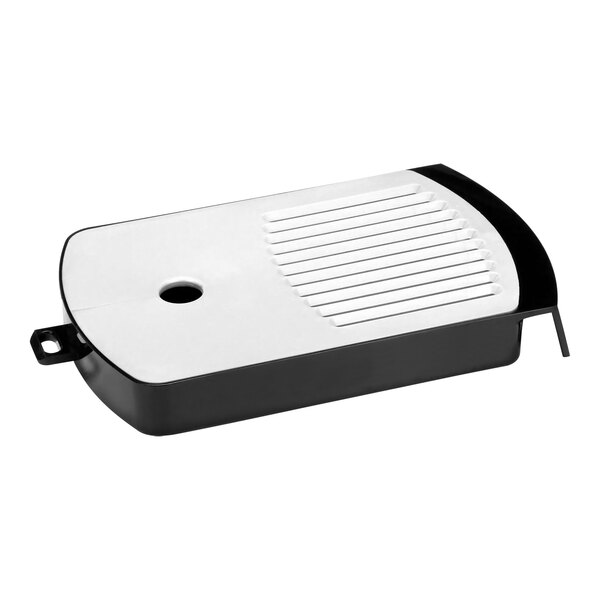 A black and white rectangular Fetco drip tray assembly with a hole in the bottom.