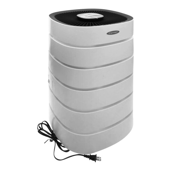 A white Carrier air purifier with a black round top and attached cord.