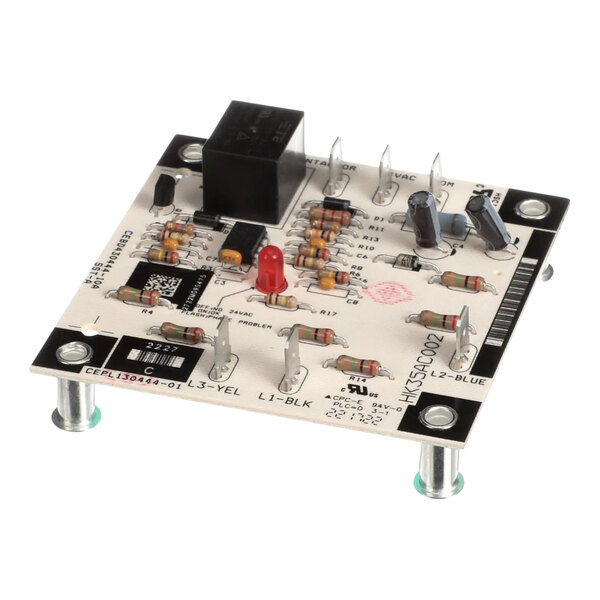 A Carrier HK35AC002 relay phase monitor, a small black cube with a red button and white text.
