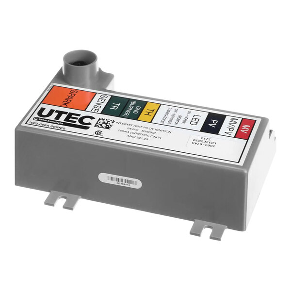 A close-up of a Carrier LH33CZ010 Ignition Module, a grey rectangular object with a label.