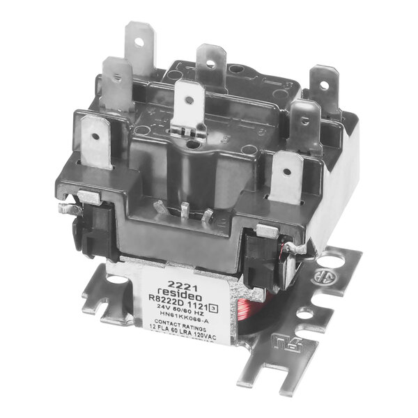 A white rectangular Carrier fan center relay with a black oval.
