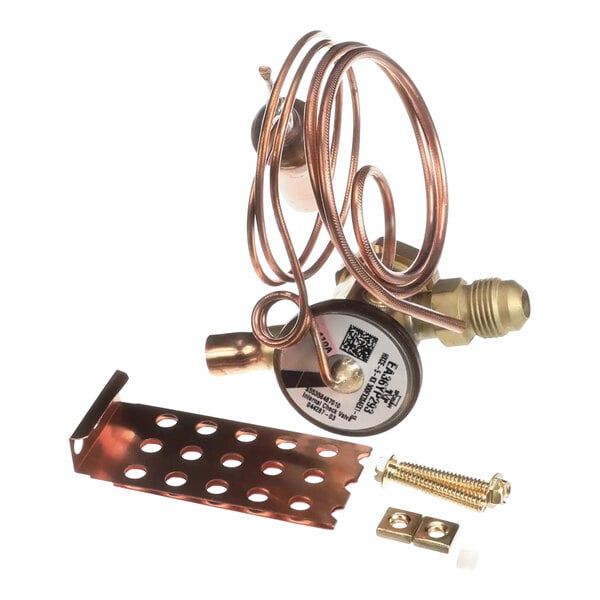A copper plate with a round label reading "Carrier 332368-755 Txv Valve Kit"