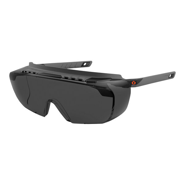 A pair of Ergodyne Skullerz over-the-glass safety glasses with a black frame and smoke lenses.