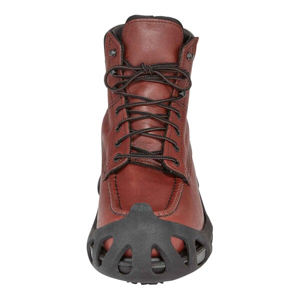 A brown shoe with a black ice cleat attached.