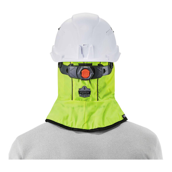 A person wearing a safety helmet and a hi-vis lime green Ergodyne N-Ferno winter hard hat liner.