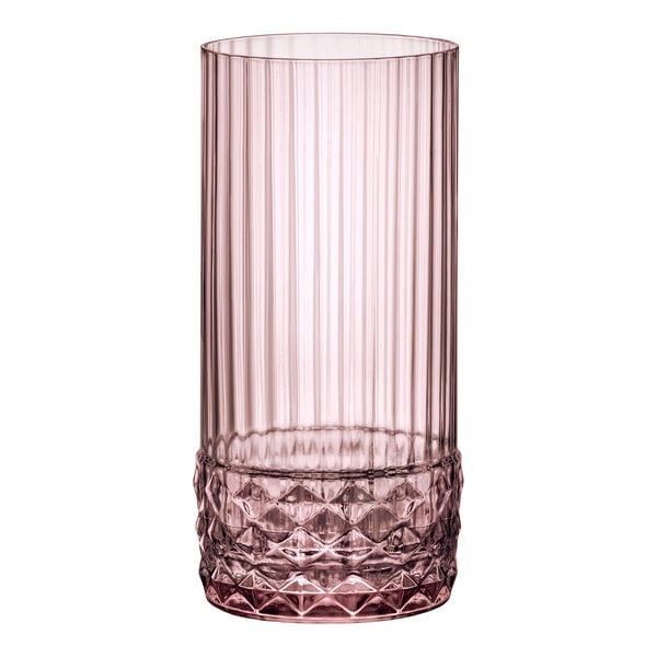 A Bormioli Rocco America rose cooler glass with a diamond pattern in pink.