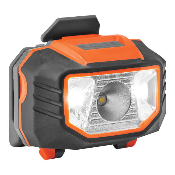 An orange and black Ergodyne Skullerz headlamp with LED lights.